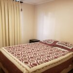 Bedroom_with_bed_and_window_202607161806
